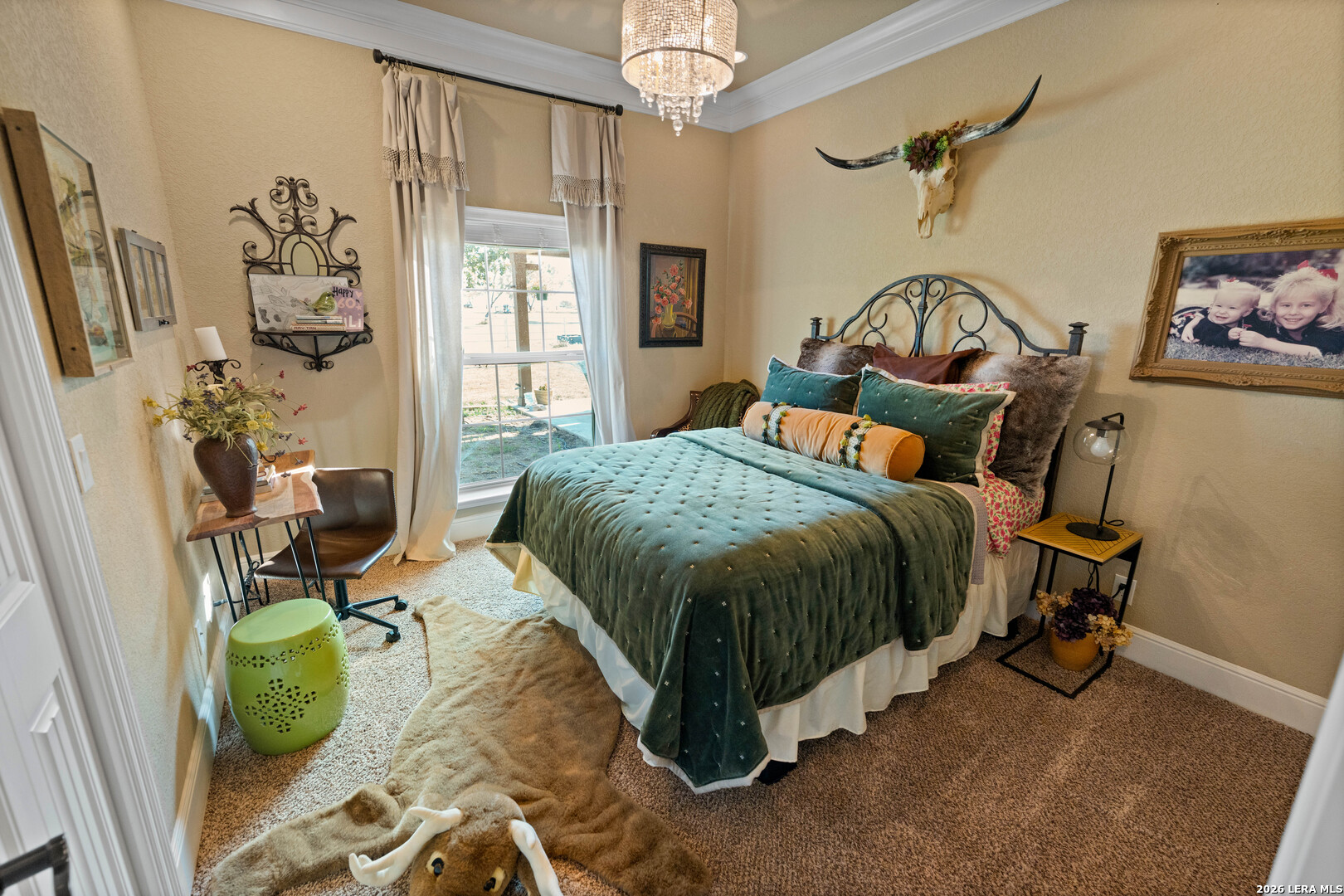 5002 Fm 476 Poteet, TX 78065 - Photo 45 of 50 a bedroom with a bed and a chandelier