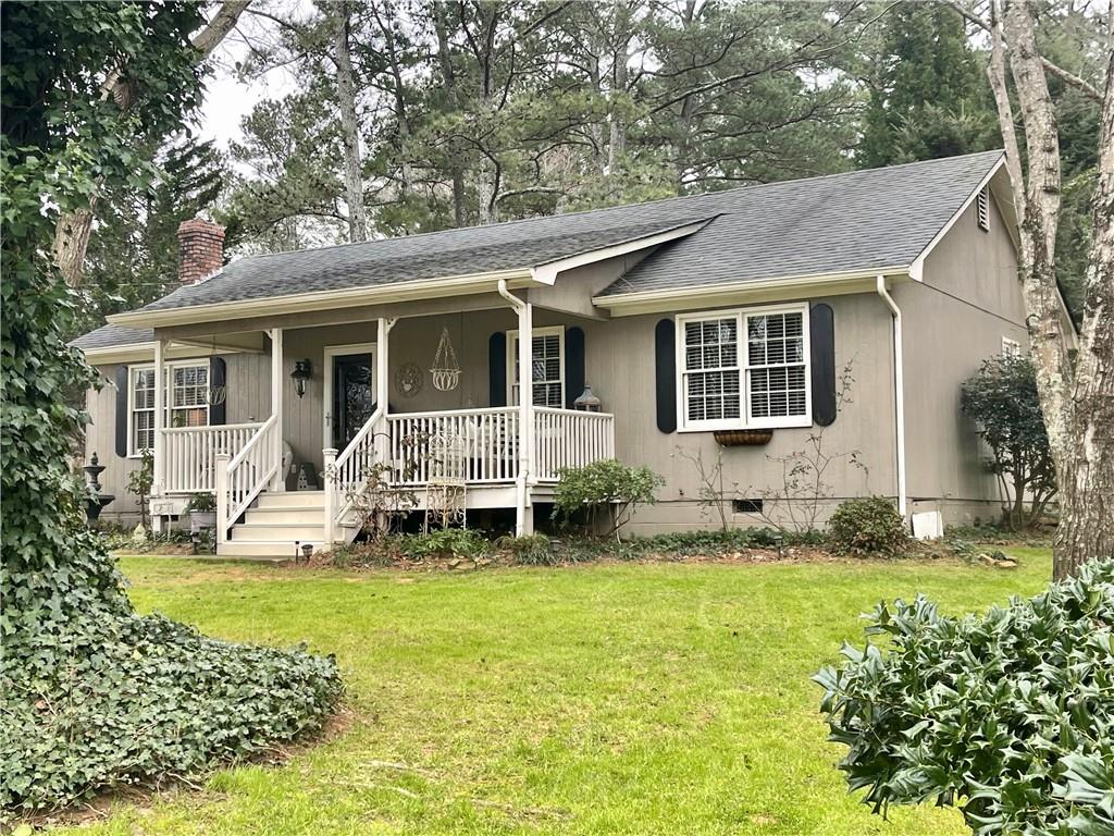 54 Lee Road Southeast Cartersville, GA 30121 - Photo 1 of 1 a view of a house with a yard patio and a large tree