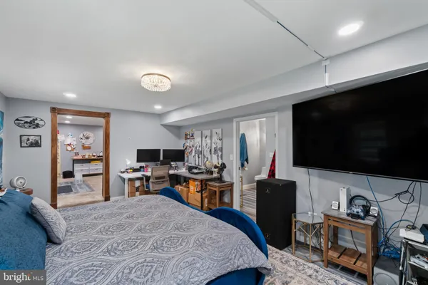 a workspace with furniture and a flat screen tv