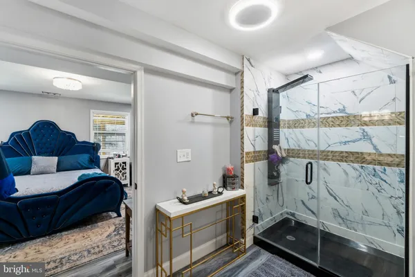 a living room with a couch and a potted plant