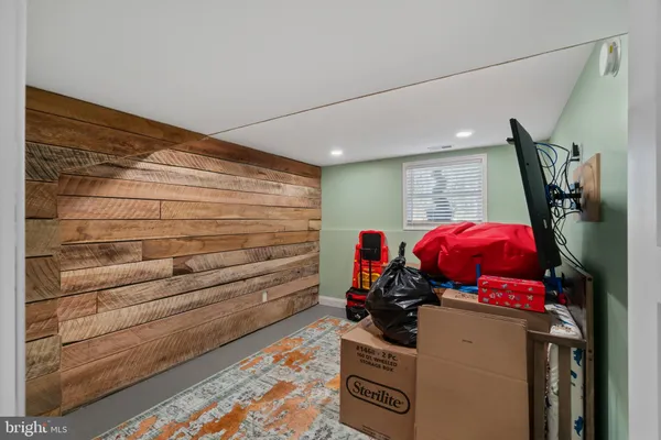 a bathroom with a sink vanity and mirror