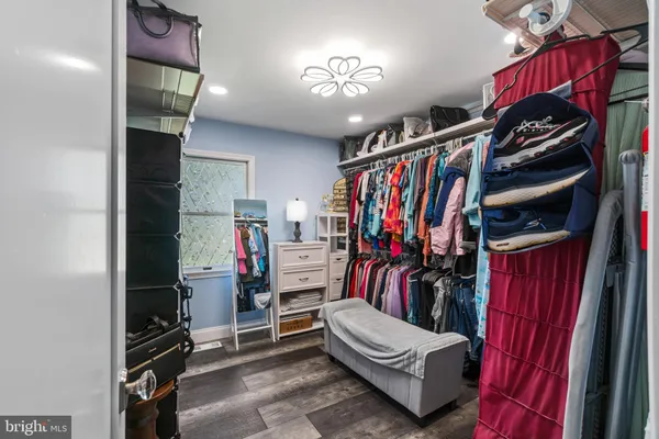 a white toilet sitting next to a bathroom sink and vanity