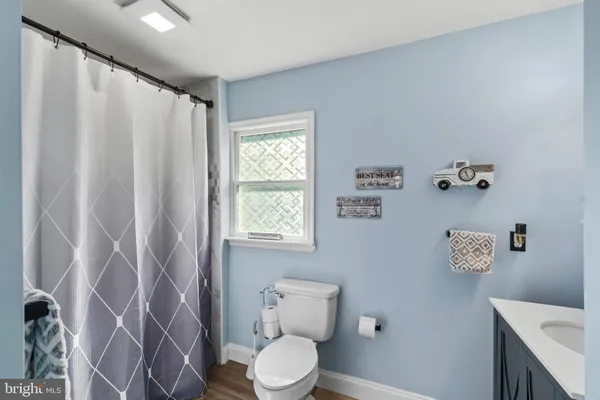 a view of deck with table and chairs and wooden floor