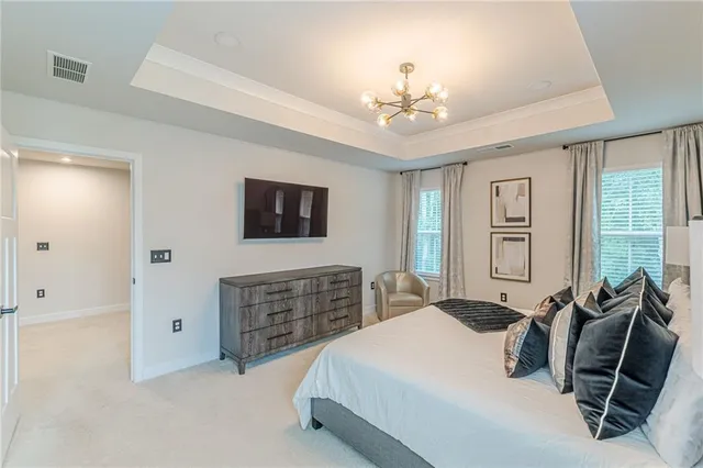 a bedroom with a bed and ceiling fan