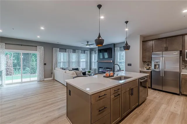 a kitchen with a stove sink and refrigerator