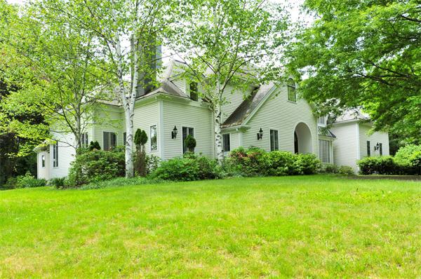 284 South Great Road Lincoln, MA 01773 - Photo 1 of 13 a front view of a house with a garden