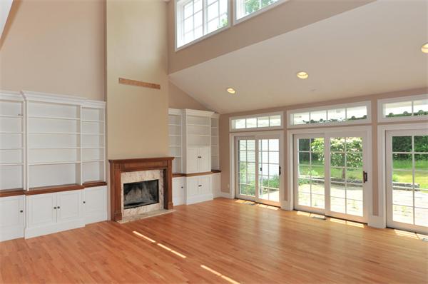 284 South Great Road Lincoln, MA 01773 - Photo 5 of 13 a view of empty room with a fireplace and window