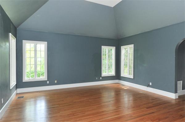 284 South Great Road Lincoln, MA 01773 - Photo 9 of 13 an empty room with wooden floor and windows