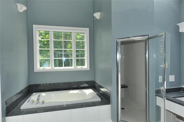 284 South Great Road Lincoln, MA 01773 - Photo 10 of 13 a bathroom with a tub and a window