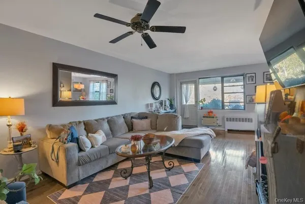 a living room with furniture and a window