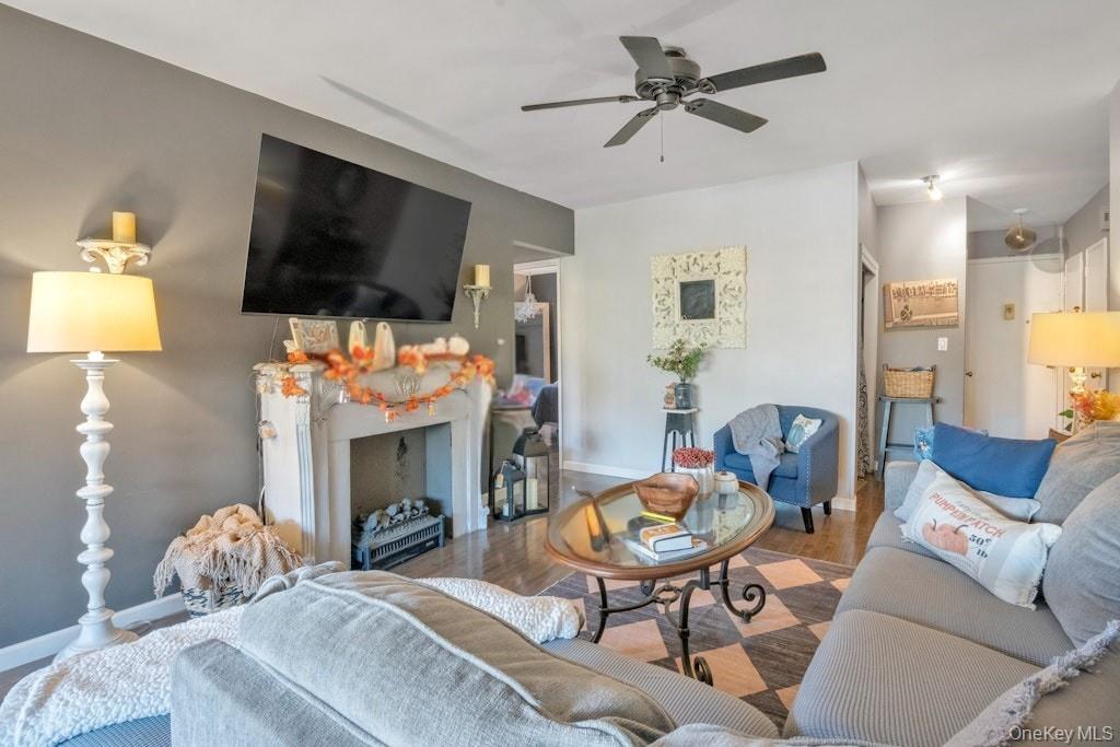 620 Pelham Road, Unit 6G New Rochelle, NY 10805 - Photo 8 of 22 a living room with furniture a flat screen tv and a fireplace