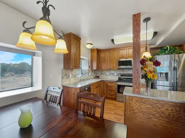 a living room with fireplace furniture and a wooden floor