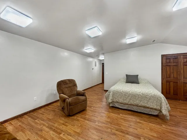 a bedroom with bed and window