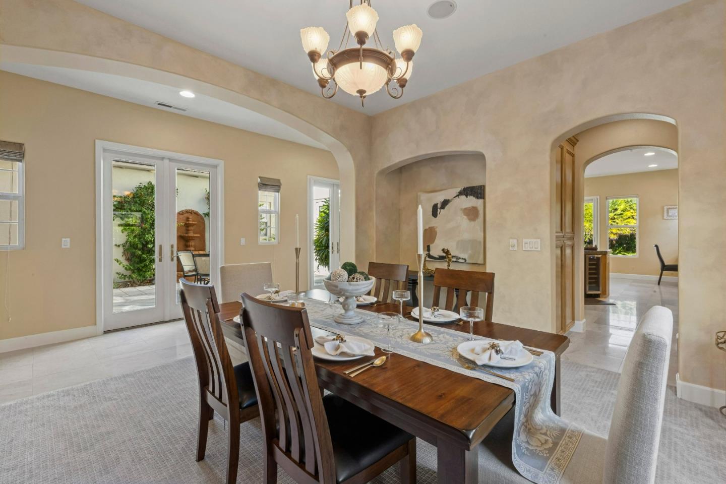 7466 Dunbar Court Gilroy, CA 95020 - Photo 18 of 103 a view of a dining room with furniture and chandelier