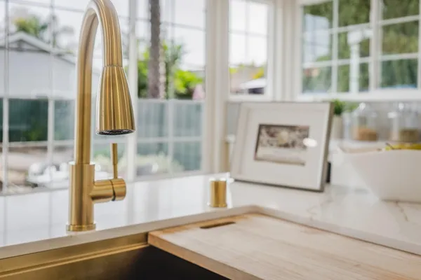 a kitchen with stainless steel appliances a stove a sink and a refrigerator