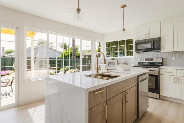 a kitchen with a window a sink and a counter top space