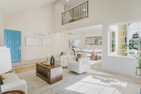 a living room with furniture and a table