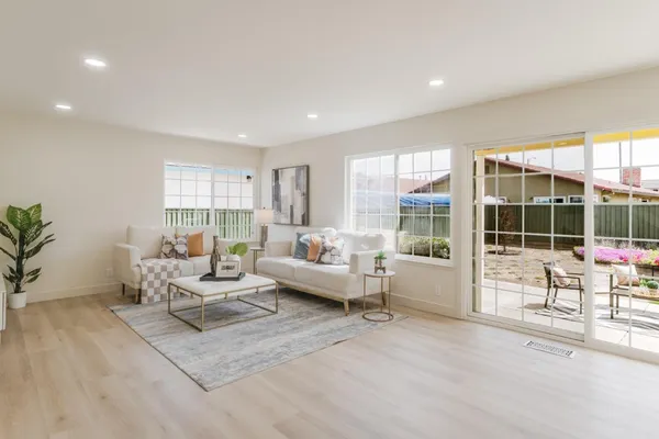 a bedroom with bed and wooden floor