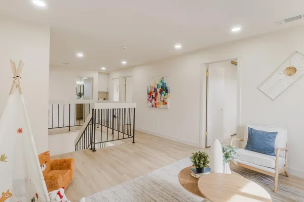 a bedroom with a bed and a couch