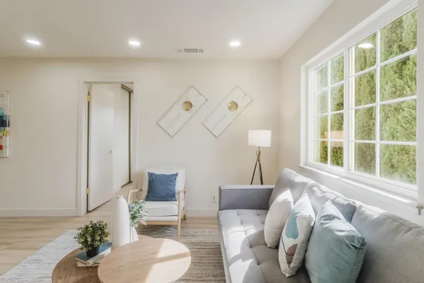 a bedroom with a bed and a lamp on table