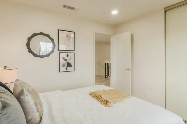 a view of a patio with table and chairs potted plants with wooden floor