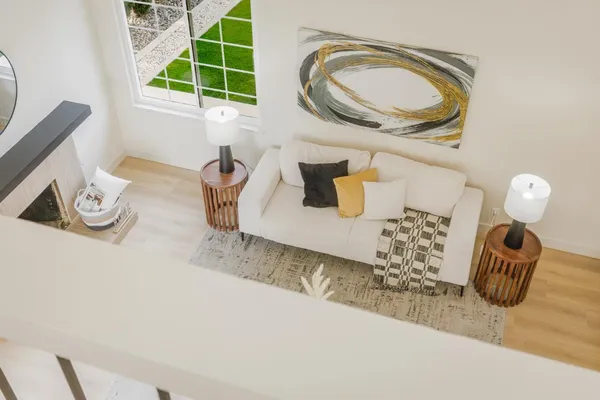 a living room with lots of furniture and a wooden floor