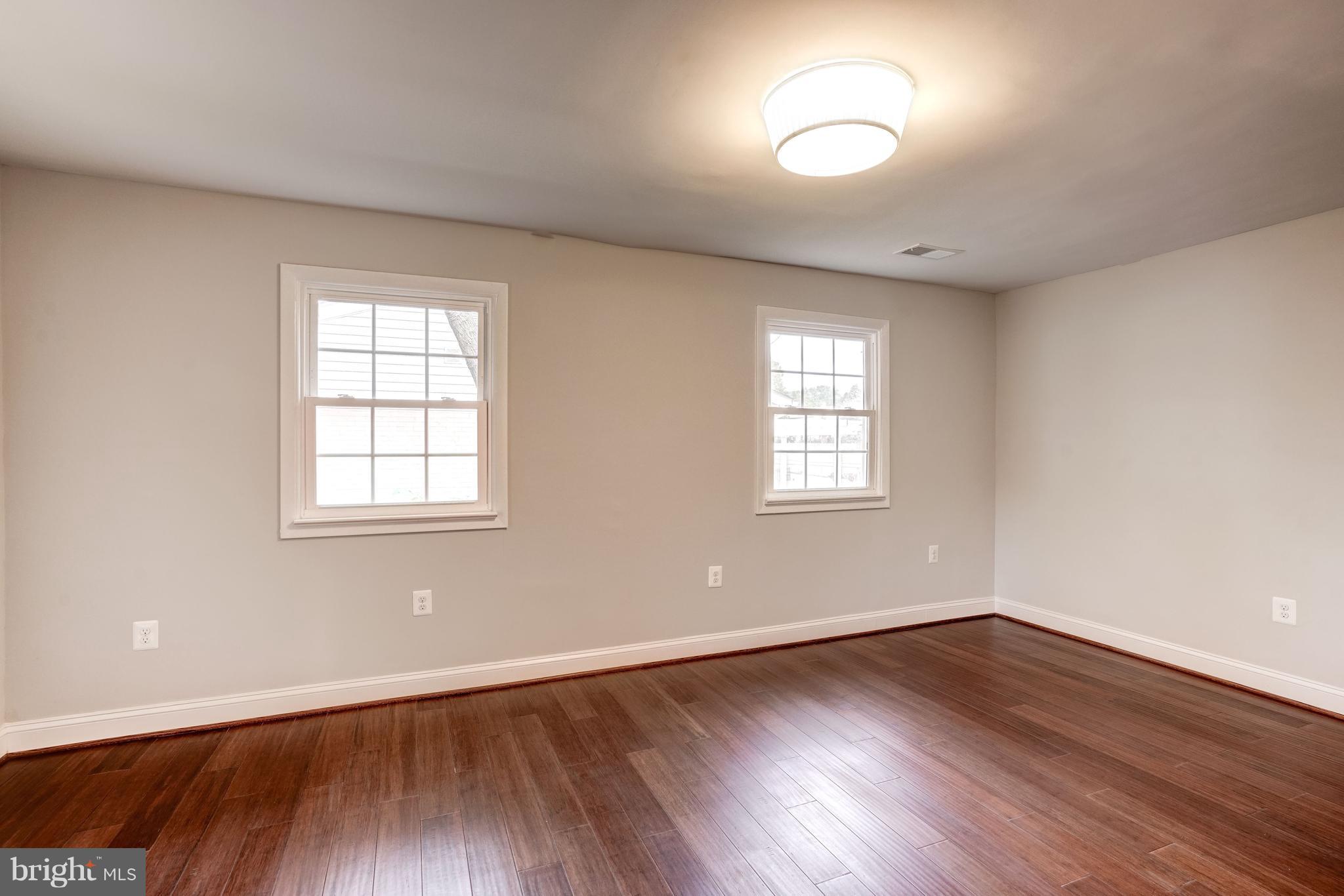4121 Lees Corner Road Chantilly, VA 20151 - Photo 14 of 28 an empty room with wooden floor and windows
