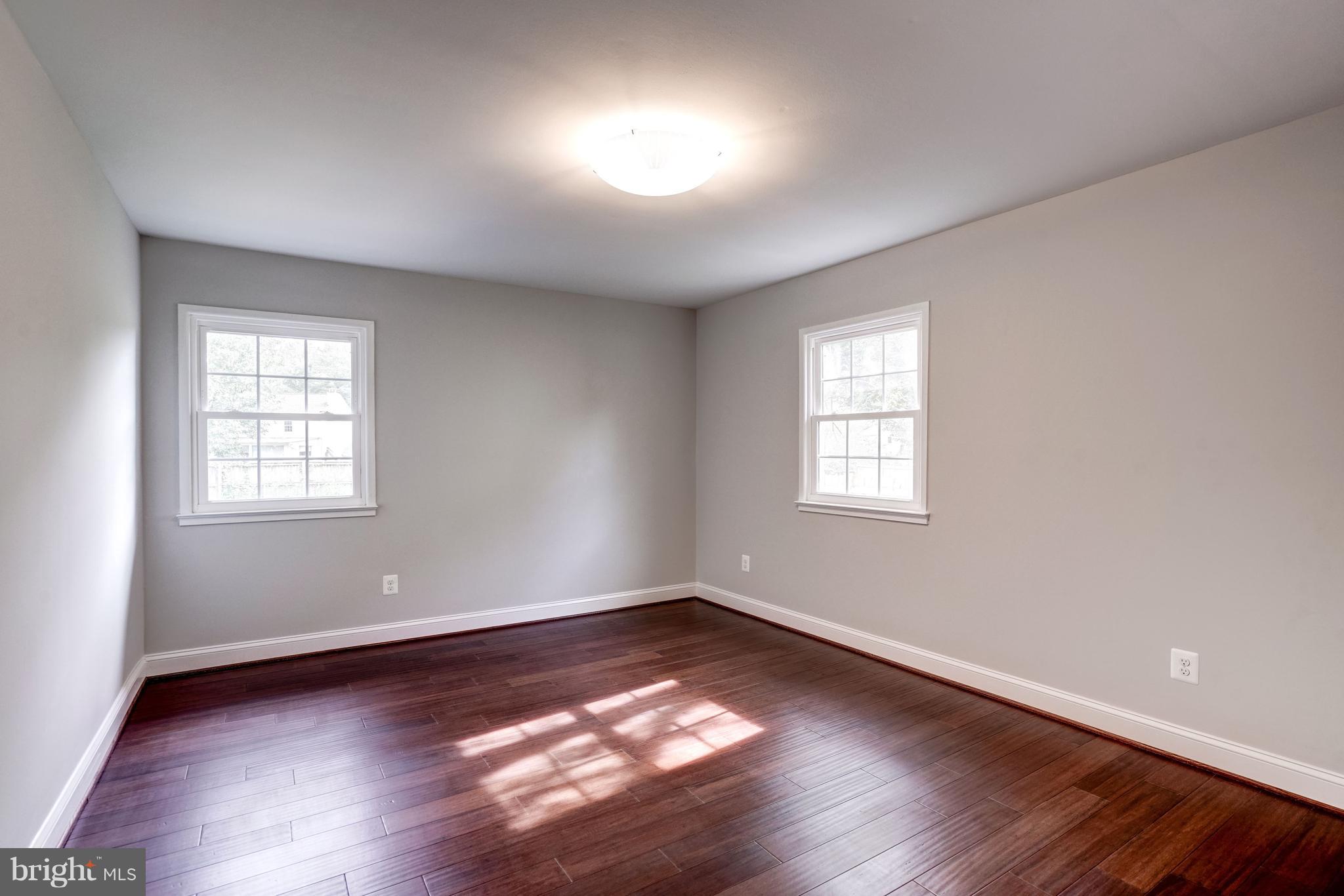 4121 Lees Corner Road Chantilly, VA 20151 - Photo 23 of 28 an empty room with wooden floor and windows
