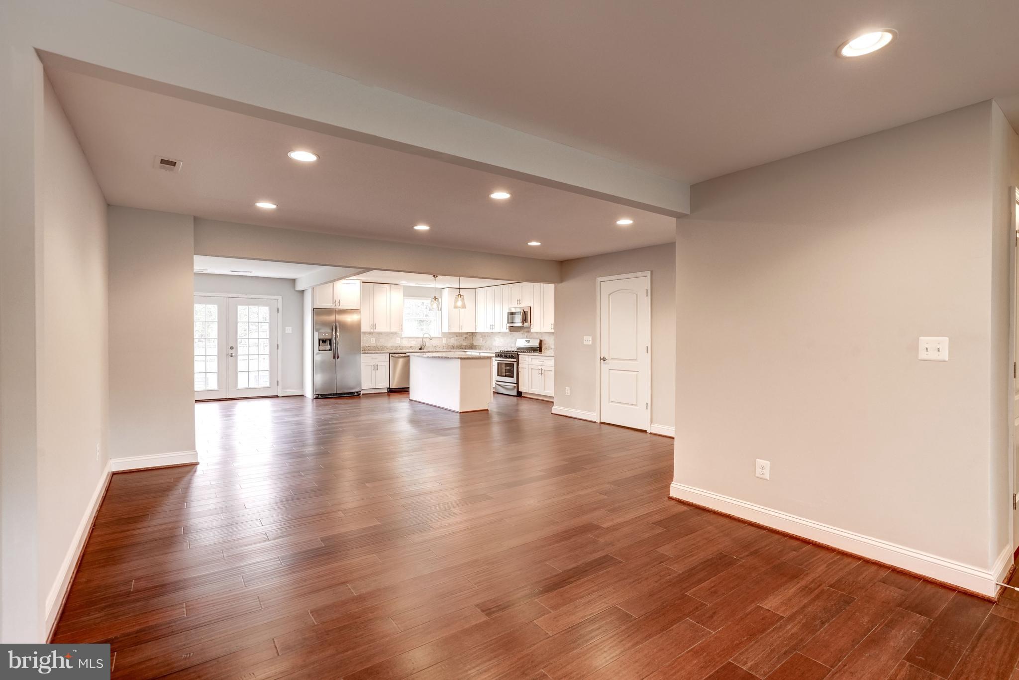4121 Lees Corner Road Chantilly, VA 20151 - Photo 4 of 28 a view of an empty room with wooden floor and a window