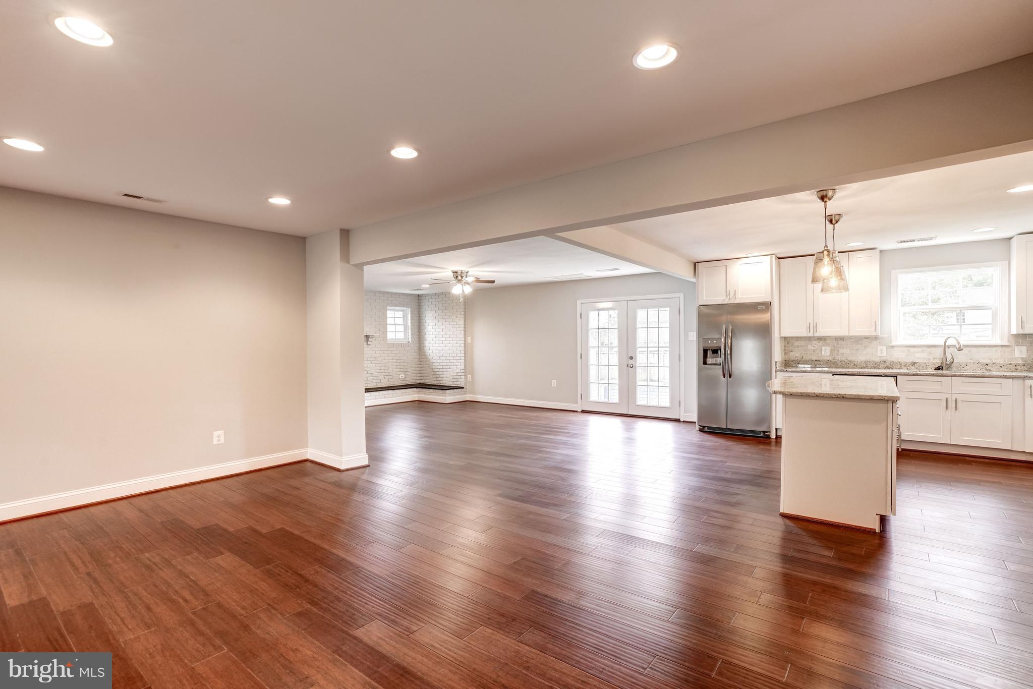 4121 Lees Corner Road Chantilly, VA 20151 - Photo 6 of 28 a view of empty room with wooden floor and kitchen view