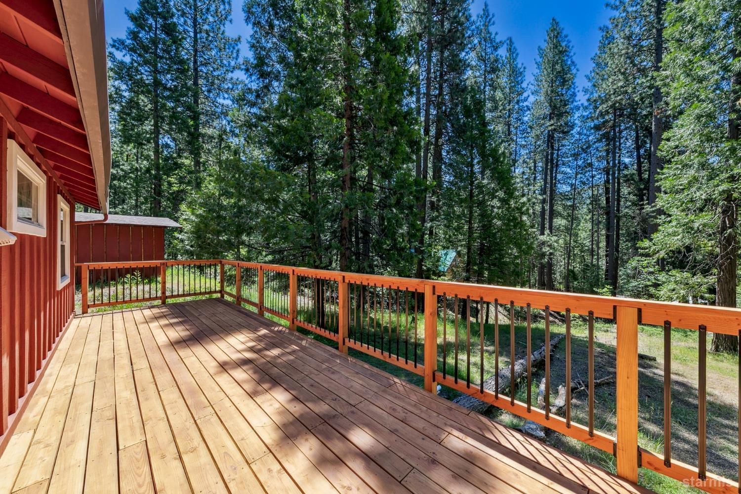 11523 Pickwick Street Kyburz, CA 95720 - Photo 17 of 24 a view of a balcony with wooden floor and outdoor seating