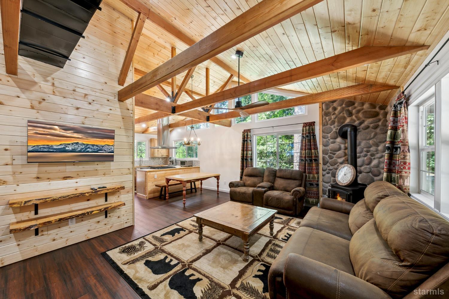 11523 Pickwick Street Kyburz, CA 95720 - Photo 8 of 24 a living room with furniture and a flat screen tv