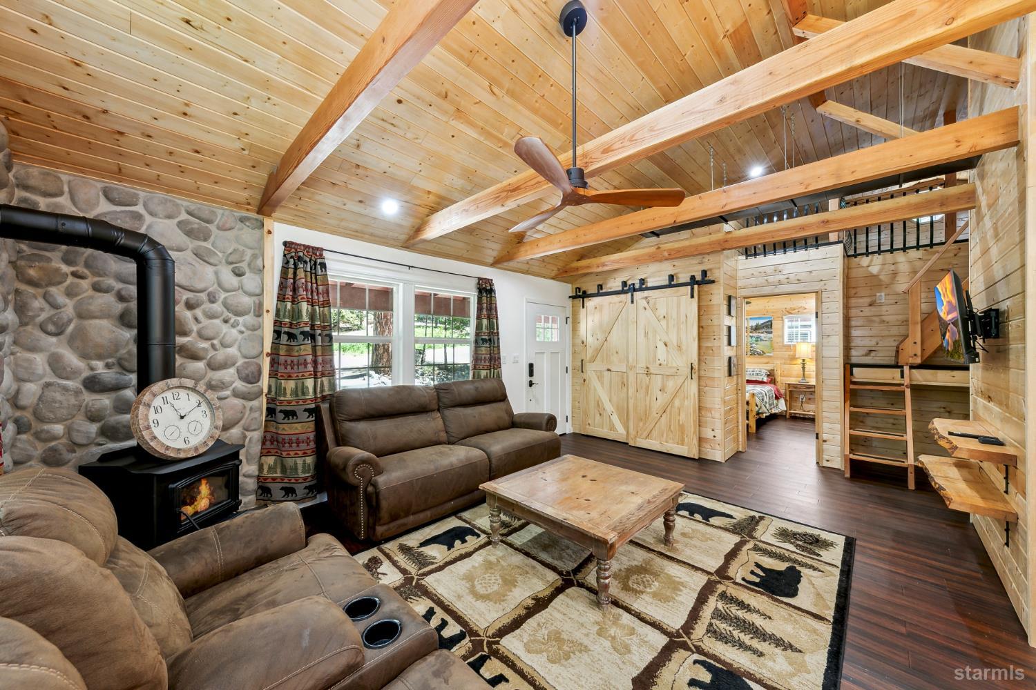 11523 Pickwick Street Kyburz, CA 95720 - Photo 10 of 24 a living room with furniture and a wooden floor