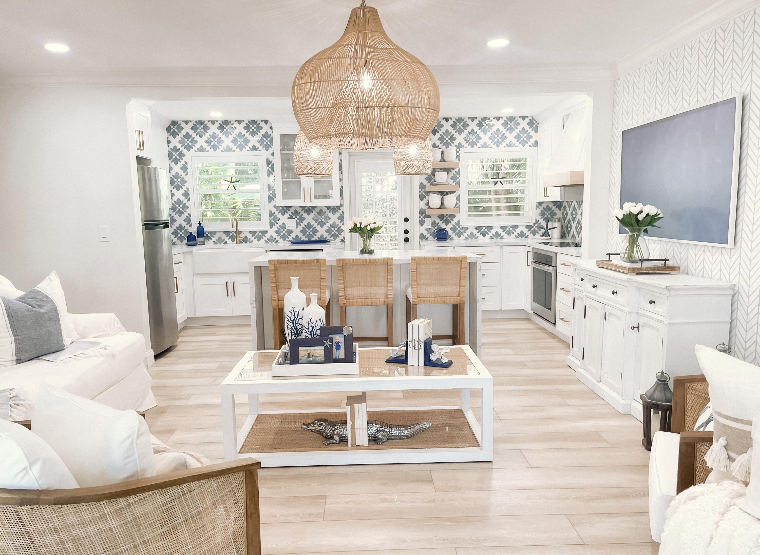 a view of living room with furniture and a chandelier