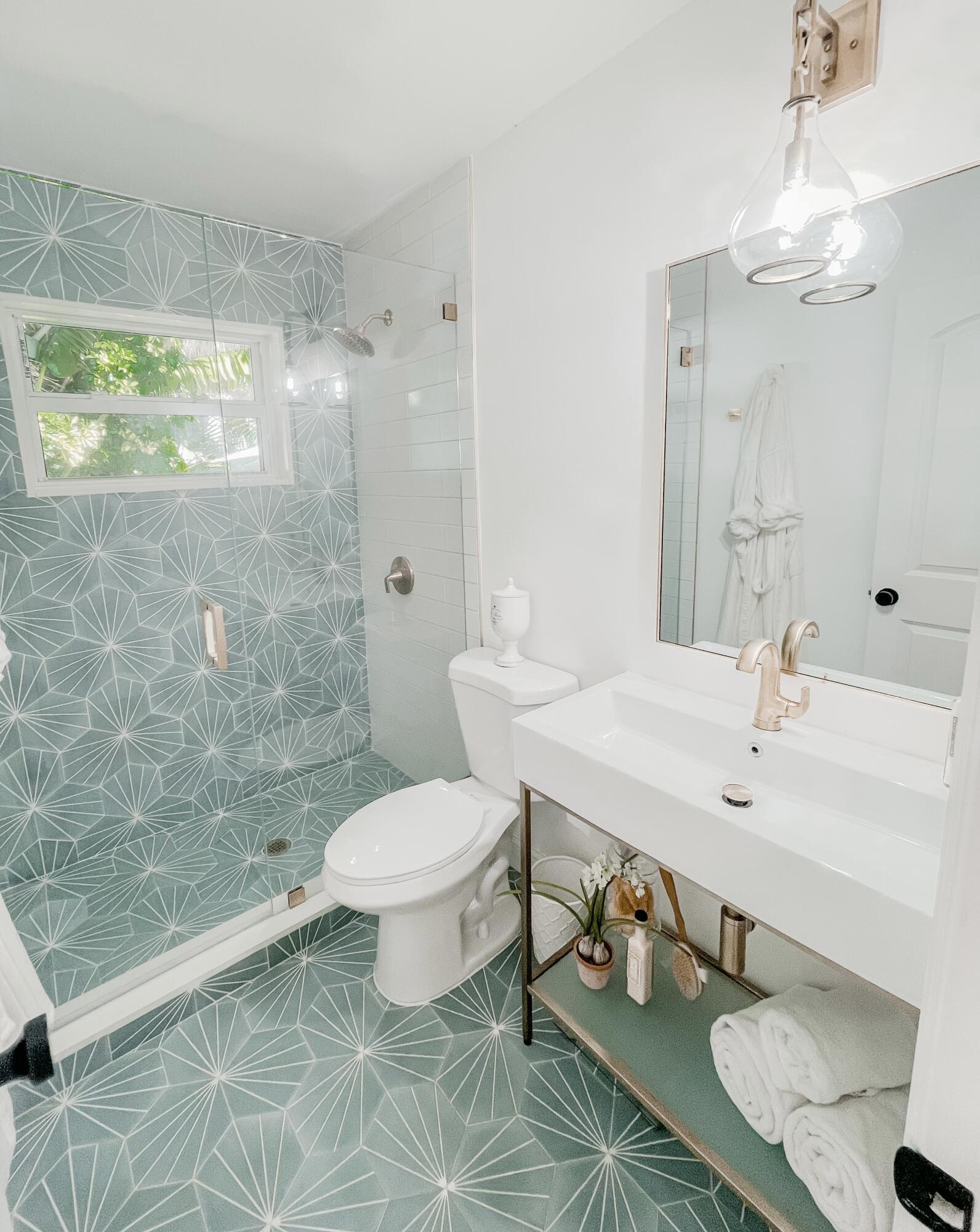 7 Fayette Drive Ocean Ridge, FL 33435 - Photo 21 of 30 a bathroom with a sink a toilet and shower