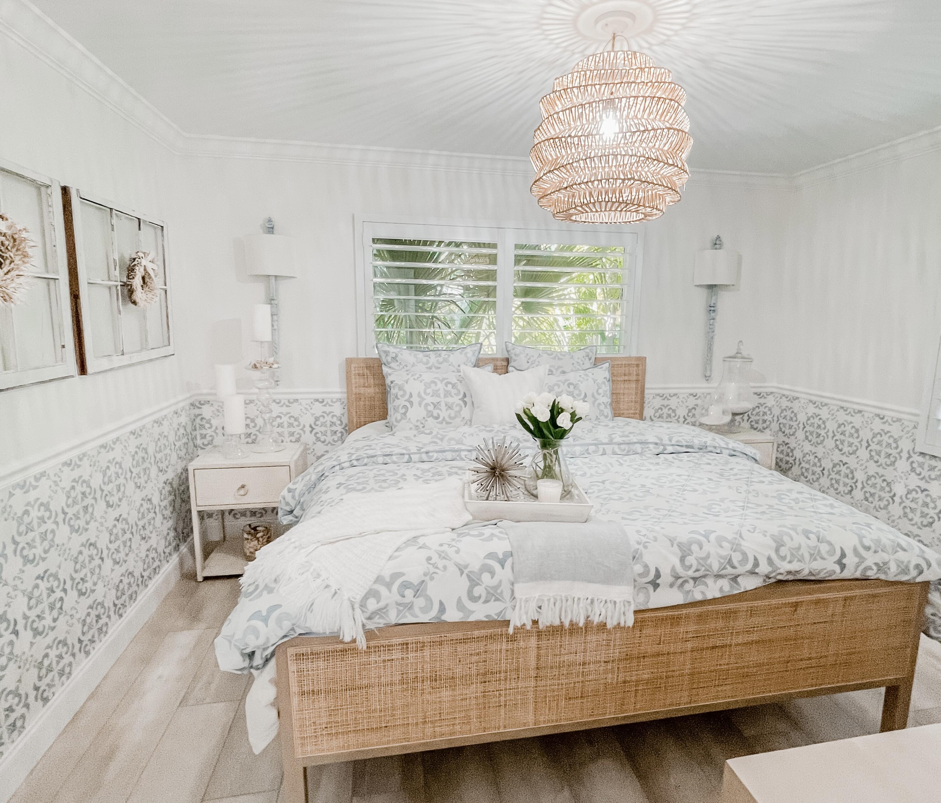 7 Fayette Drive Ocean Ridge, FL 33435 - Photo 22 of 30 a bedroom with a bed potted plant on the counter and a large window