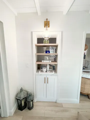 a room with a book shelf and a shelf