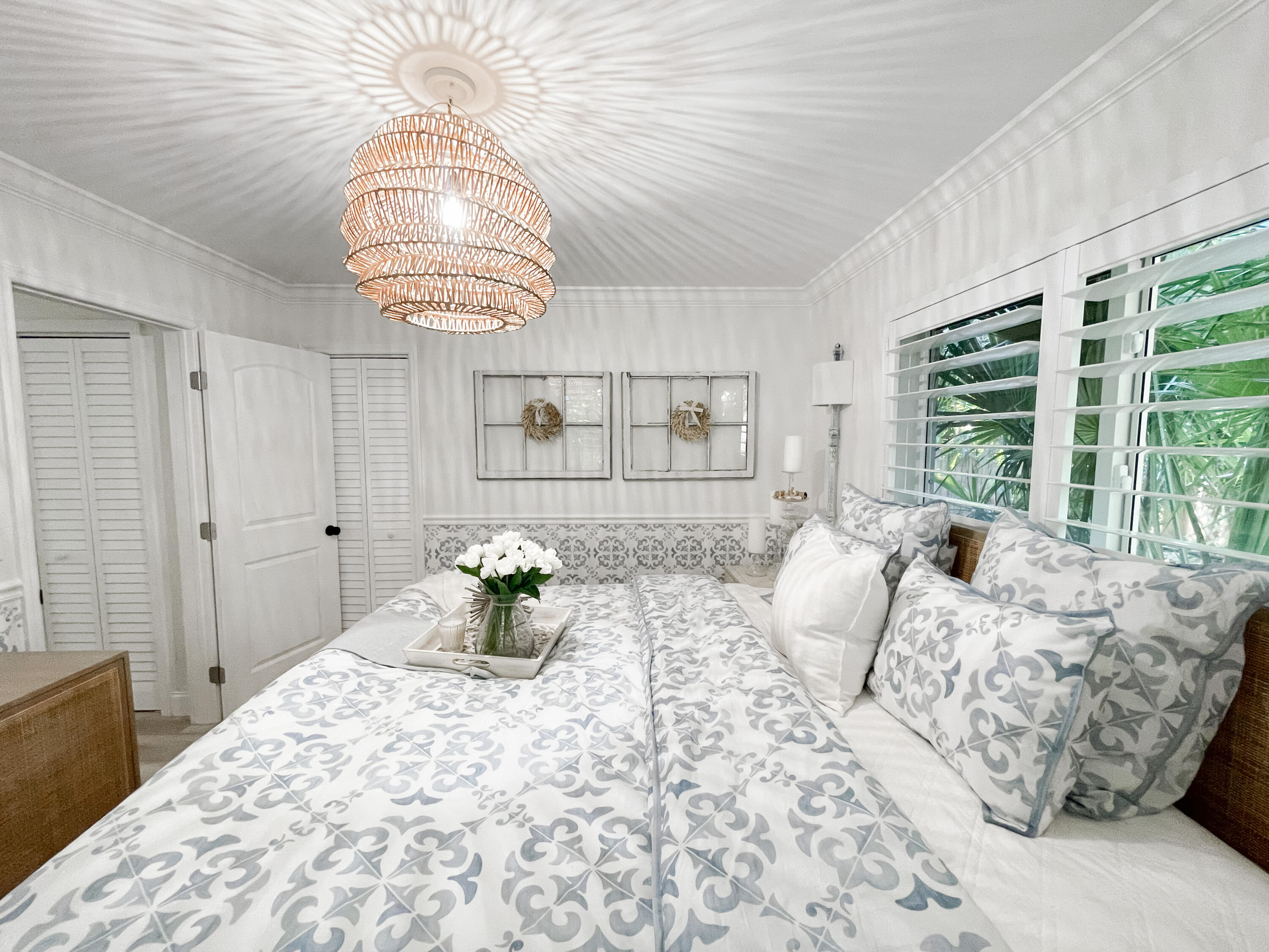 7 Fayette Drive Ocean Ridge, FL 33435 - Photo 28 of 30 a bedroom with a bed and a chandelier