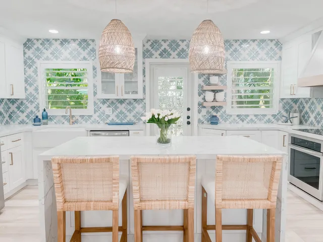 a dining table with chairs and chandelier