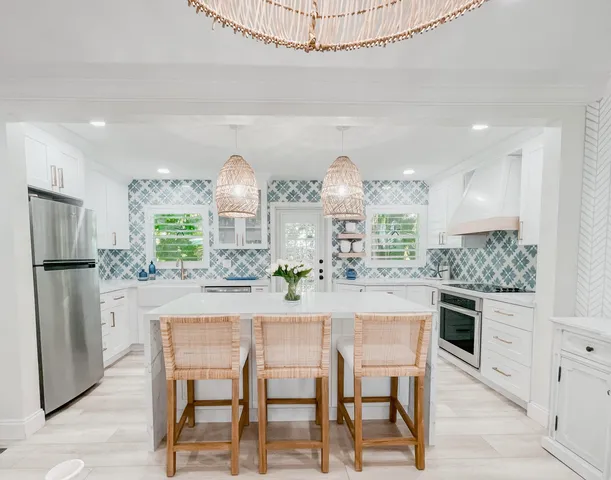 a kitchen with a table and chairs in it
