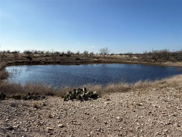 a view of a lake next to a building with a lake