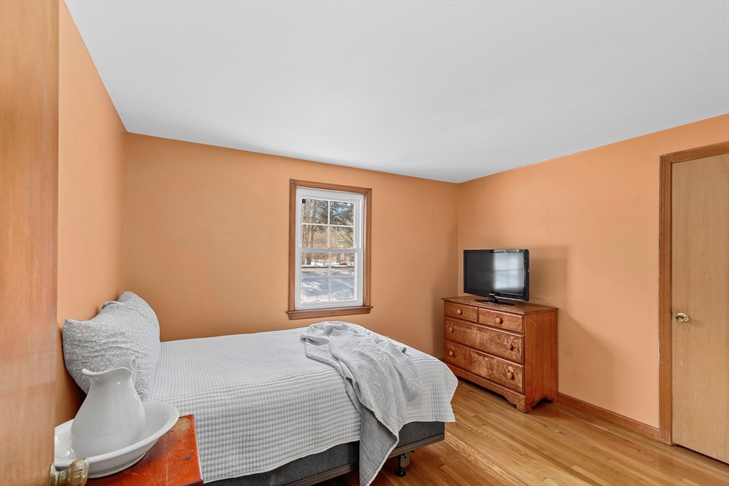 161 Wapping Road Kingston, MA 02364 - Photo 13 of 18 a bedroom with a bed and a television