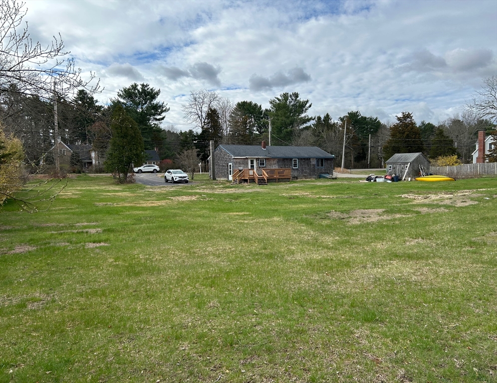 161 Wapping Road Kingston, MA 02364 - Photo 18 of 18 a backyard of a house with table and chairs