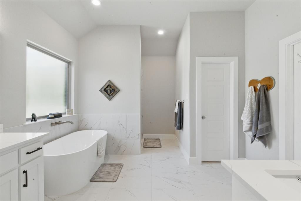 247 Gopher Road Weatherford, TX 76088 - Photo 17 of 35 a bathroom with a sink a toilet and shower