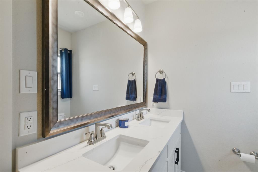 247 Gopher Road Weatherford, TX 76088 - Photo 24 of 35 a bathroom with a sink and a mirror