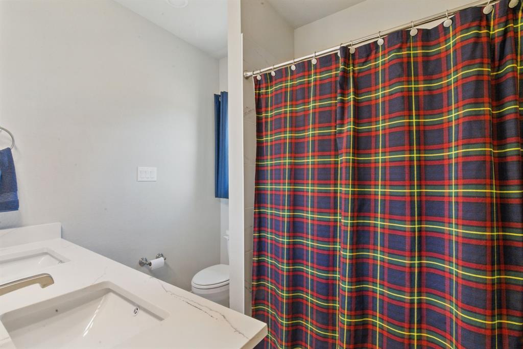 247 Gopher Road Weatherford, TX 76088 - Photo 25 of 35 a bathroom with a sink toilet and shower