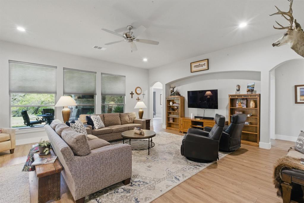 247 Gopher Road Weatherford, TX 76088 - Photo 3 of 35 a living room with furniture and a flat screen tv