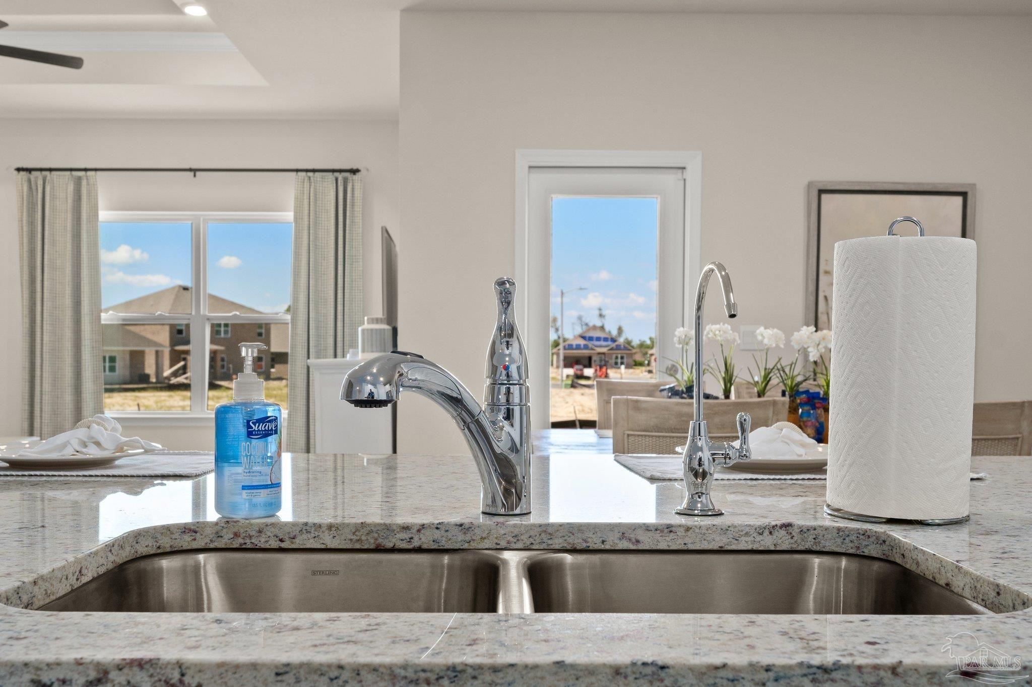 4946 Snipe Road Pace, FL 32571 - Photo 15 of 27 a kitchen with a sink and a mirror