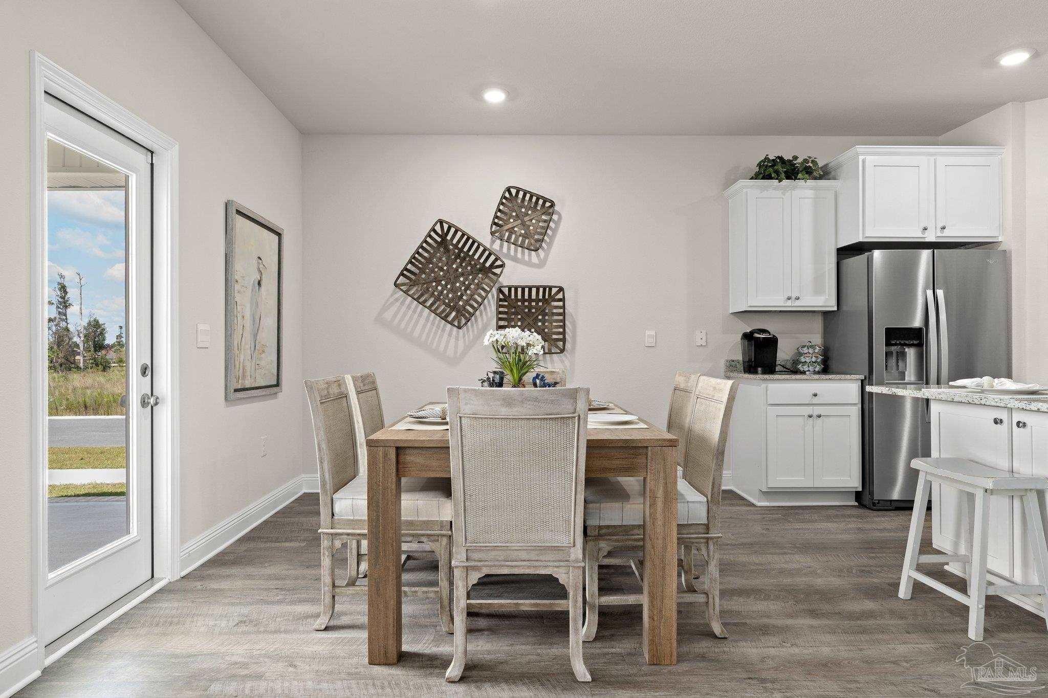 4946 Snipe Road Pace, FL 32571 - Photo 18 of 27 a view of a dining room with furniture