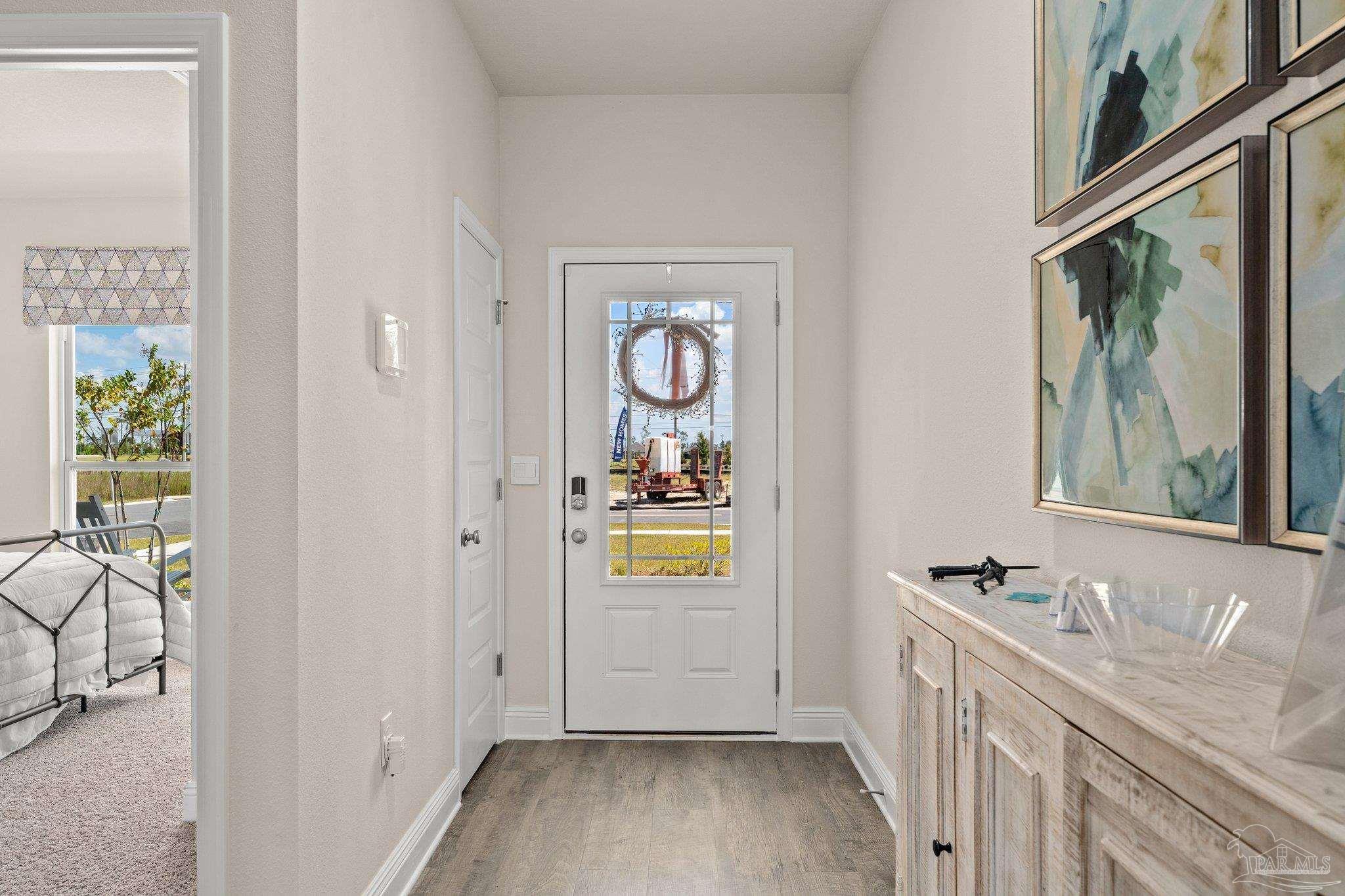 4946 Snipe Road Pace, FL 32571 - Photo 2 of 27 a bathroom with a sink and a window